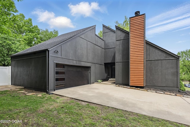 1214 Bramar Dr, Joplin, MO 64804 - view of front of property with a chimney and an attached garage