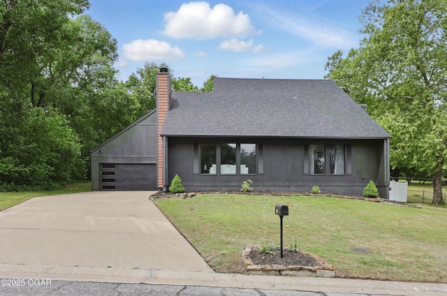 1214 Bramar Dr, Joplin, MO 64804 - view of front facade with a shingled roof, a chimney, concrete driveway, and a front lawn