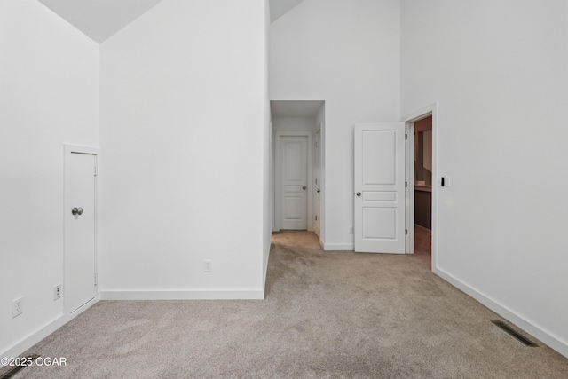 1214 Bramar Dr, Joplin, MO 64804 - carpeted spare room featuring high vaulted ceiling and baseboards