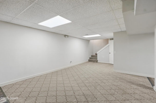 1214 Bramar Dr, Joplin, MO 64804 - finished below grade area featuring a drop ceiling, stairs, baseboards, and carpet
