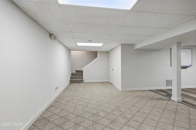 1214 Bramar Dr, Joplin, MO 64804 - finished below grade area with a drop ceiling, carpet, baseboards, and stairs