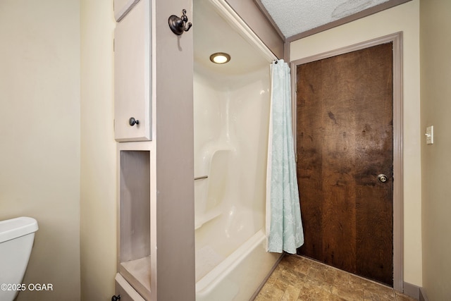 6309 Impala Dr, Joplin, MO 64804 - bathroom featuring toilet, stone finish floors, a textured ceiling, and shower / bath combination with curtain