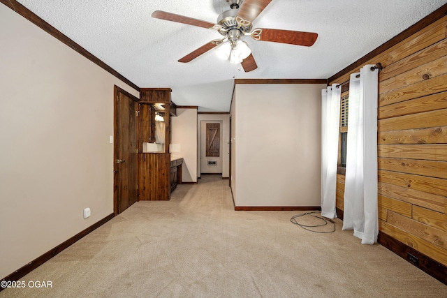 6309 Impala Dr, Joplin, MO 64804 - unfurnished bedroom featuring light carpet, crown molding, a textured ceiling, baseboards, and ceiling fan