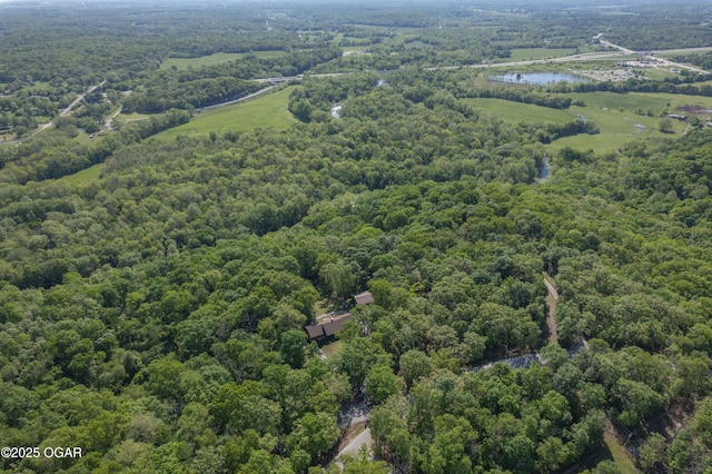 6309 Impala Dr, Joplin, MO 64804 - aerial view of a heavily wooded area and a nearby body of water