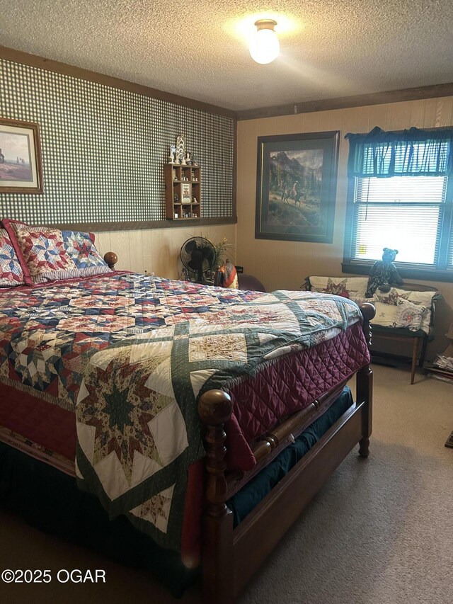 carpeted bedroom with a textured ceiling