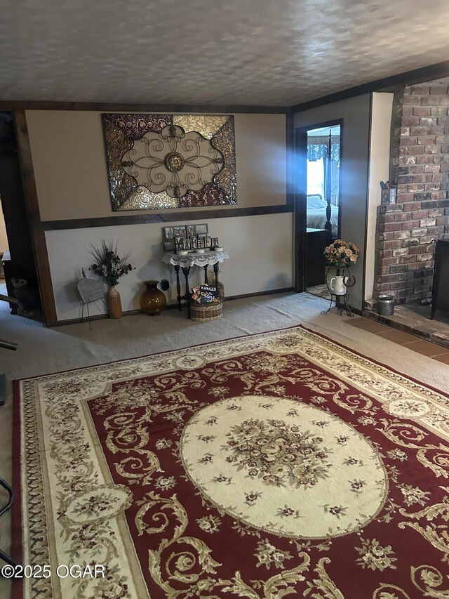 foyer with carpet and a textured ceiling