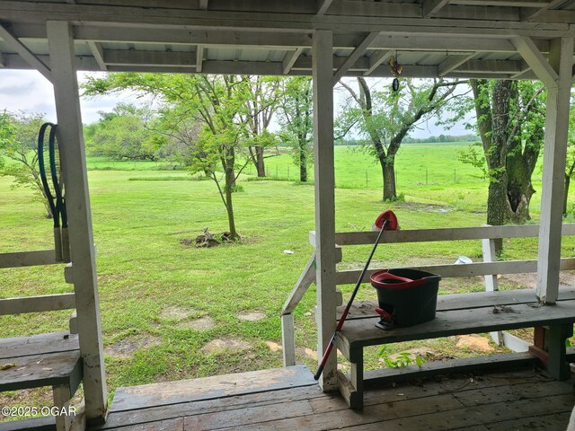view of grassy yard with a view of rural / pastoral area