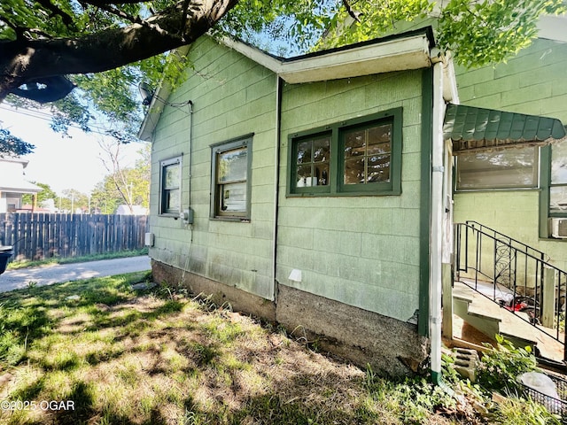 view of side of property with fence