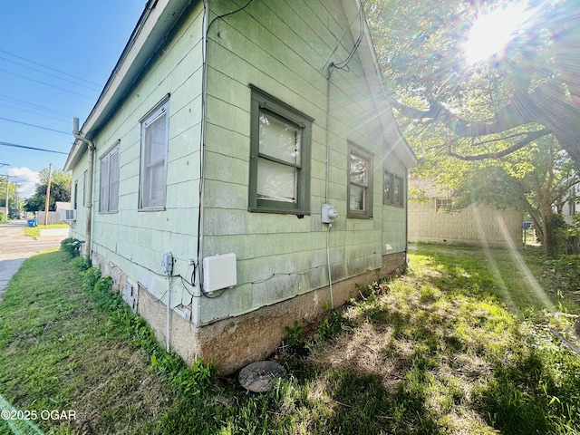 view of side of property featuring cooling unit