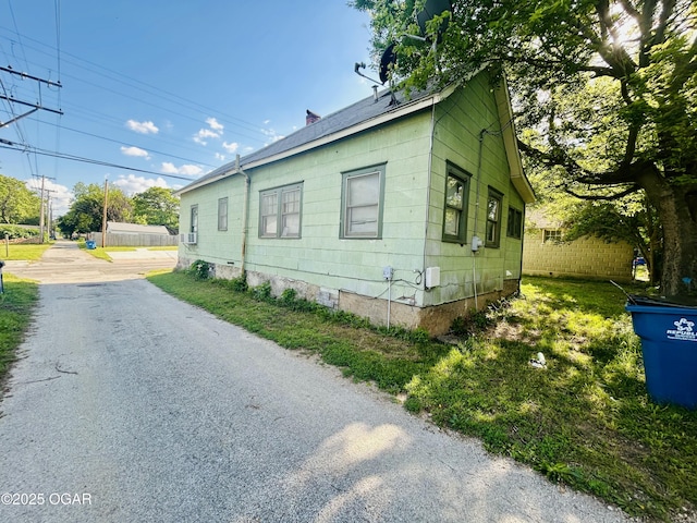 view of side of home with fence