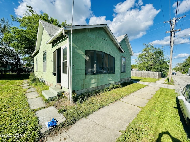 view of side of property with entry steps