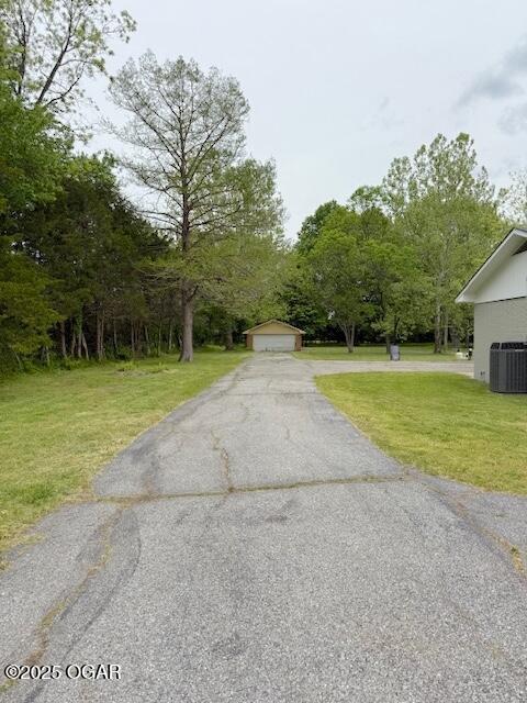 view of road featuring aphalt driveway