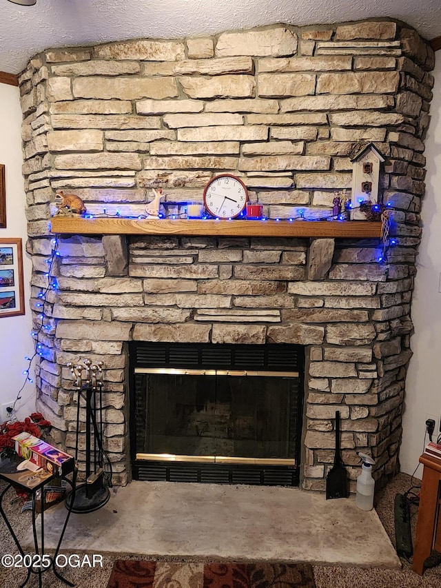 detailed view of a stone fireplace and concrete floors