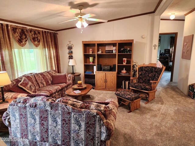 living area featuring ornamental molding, carpet flooring, and a ceiling fan