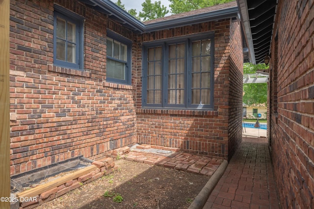 view of property exterior featuring brick siding