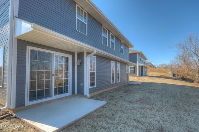 rear view of property with a patio area