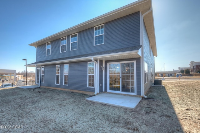 back of house featuring central AC unit