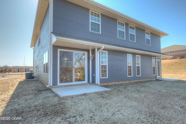 rear view of house featuring a patio and central air condition unit