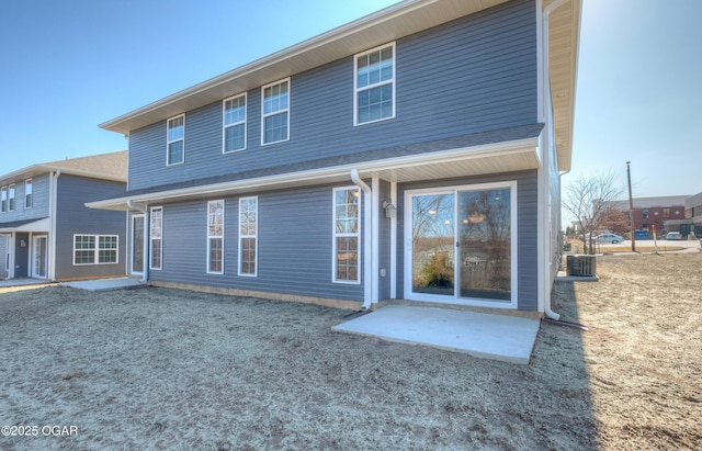 back of house featuring central air condition unit and a patio area