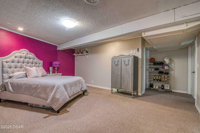 carpeted bedroom with a textured ceiling and baseboards