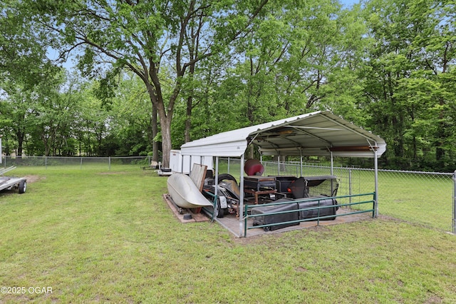 view of yard with a carport and view of scattered trees