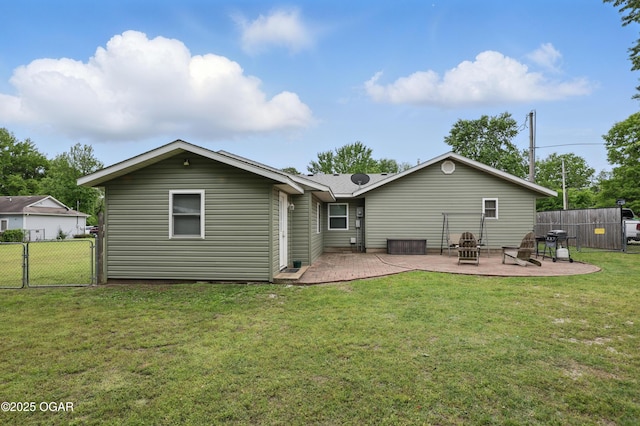 rear view of property with a patio and a gate