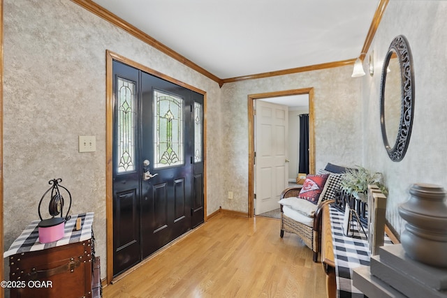 entryway featuring light wood finished floors and ornamental molding