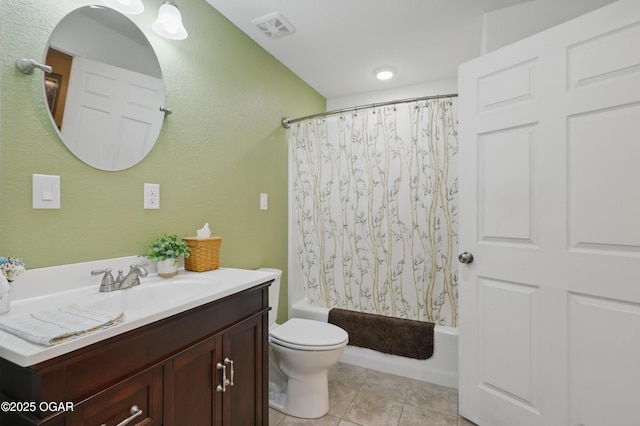 bathroom featuring toilet, shower / bath combination with curtain, vanity, and tile patterned floors