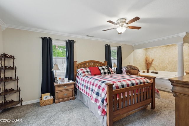 carpeted bedroom featuring ornamental molding, a ceiling fan, and baseboards