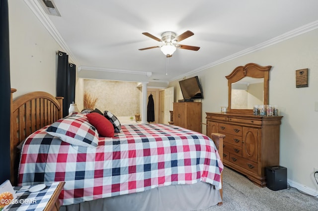 bedroom featuring carpet floors, crown molding, a ceiling fan, and baseboards