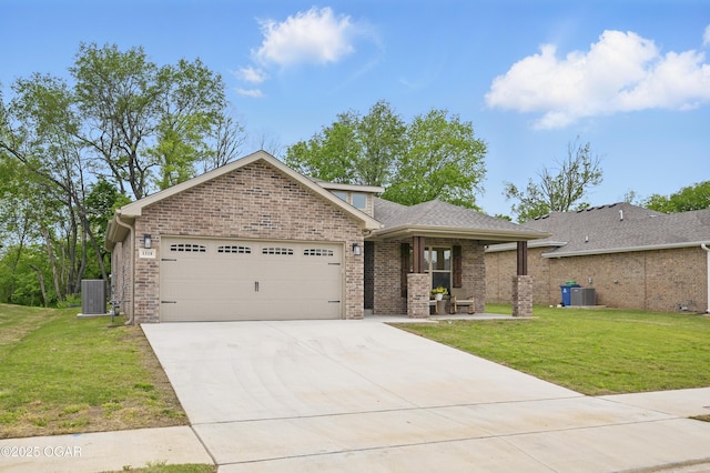 1318 Foundry Dr, Carthage, MO 64836 - ranch-style house with a garage, concrete driveway, a front yard, and brick siding