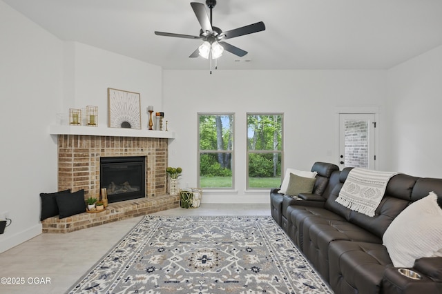 1318 Foundry Dr, Carthage, MO 64836 - living room with ceiling fan, a fireplace, and baseboards