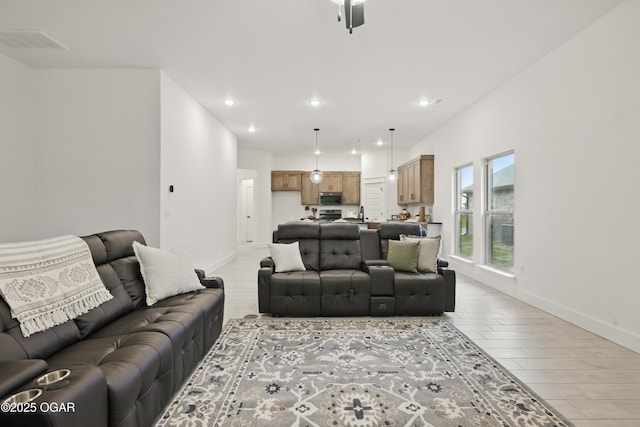 1318 Foundry Dr, Carthage, MO 64836 - living area with recessed lighting, baseboards, and light wood-type flooring