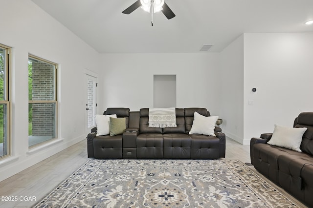 1318 Foundry Dr, Carthage, MO 64836 - living room with wood finished floors, a ceiling fan, and baseboards