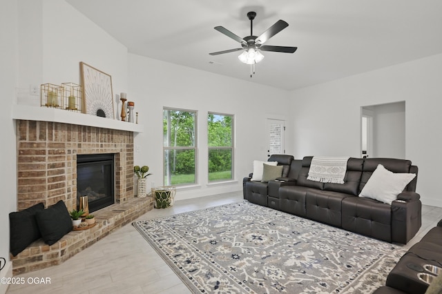 1318 Foundry Dr, Carthage, MO 64836 - living room with a ceiling fan, a brick fireplace, and wood finished floors