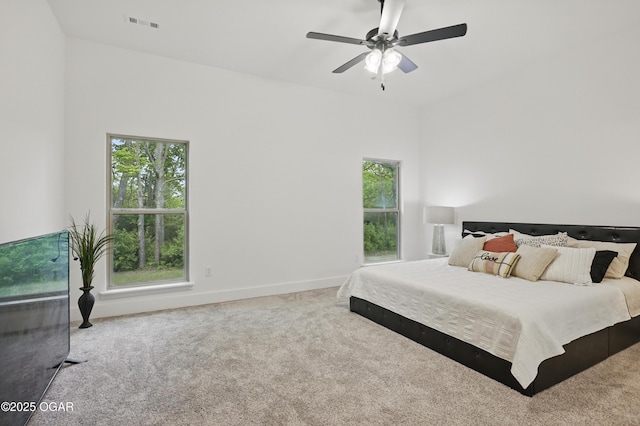 1318 Foundry Dr, Carthage, MO 64836 - carpeted bedroom with multiple windows, baseboards, and a ceiling fan