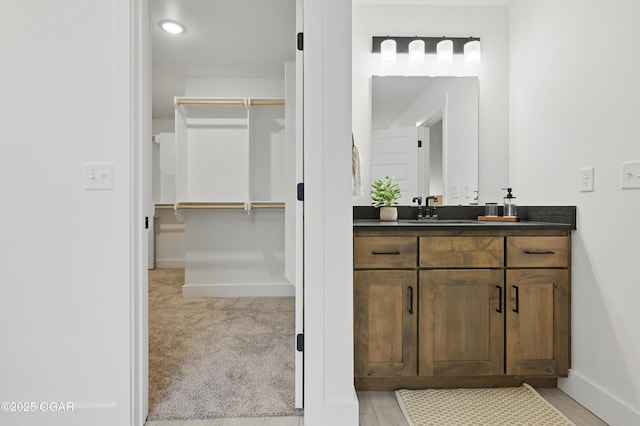 1318 Foundry Dr, Carthage, MO 64836 - bathroom featuring baseboards and vanity