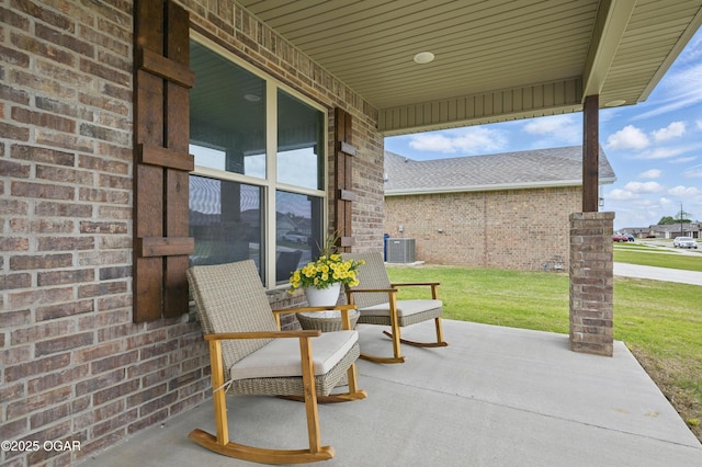 1318 Foundry Dr, Carthage, MO 64836 - view of patio / terrace featuring central AC unit and a porch
