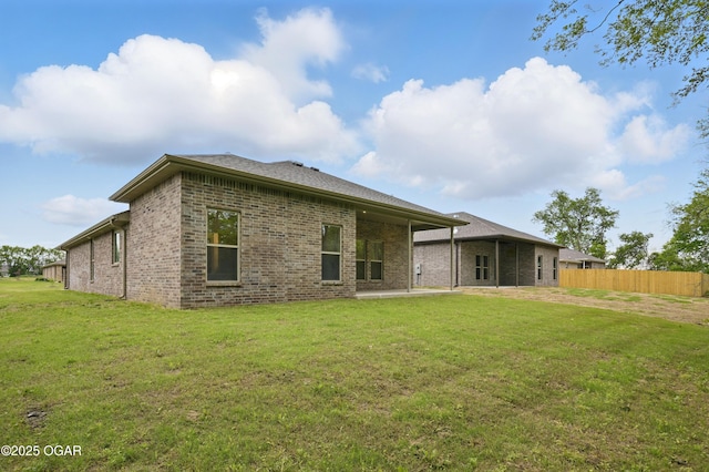 1318 Foundry Dr, Carthage, MO 64836 - back of house featuring brick siding