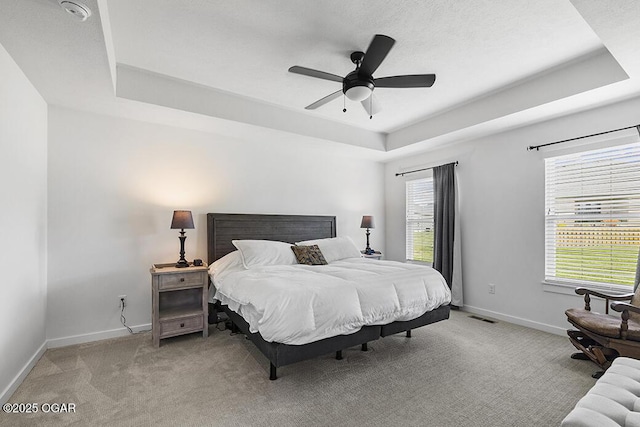 1528 N Edgemont Cir, Springfield, MO 65802 - carpeted bedroom with a raised ceiling, baseboards, and ceiling fan