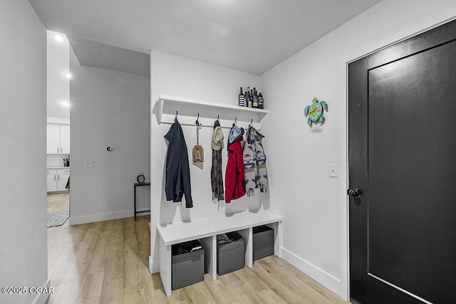 1528 N Edgemont Cir, Springfield, MO 65802 - mudroom featuring light wood-style floors and baseboards