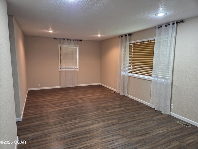 101 Van Hooser Blvd, Carl Junction, MO 64834 - unfurnished room featuring wood finished floors, baseboards, a textured ceiling, recessed lighting, and a textured wall