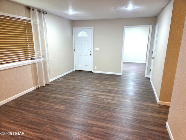 101 Van Hooser Blvd, Carl Junction, MO 64834 - entrance foyer featuring a textured wall, dark wood-style floors, and baseboards