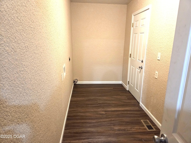 101 Van Hooser Blvd, Carl Junction, MO 64834 - hallway with a textured wall, dark wood-type flooring, and baseboards