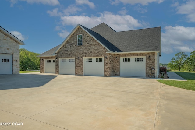 8740 County Road 241, Webb City, MO 64870 - view of property exterior with brick siding, a shingled roof, and concrete driveway