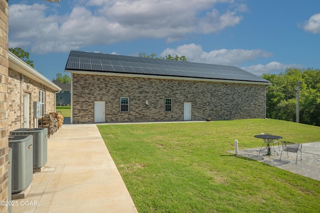 8740 County Road 241, Webb City, MO 64870 - view of grassy yard with a patio and central AC unit