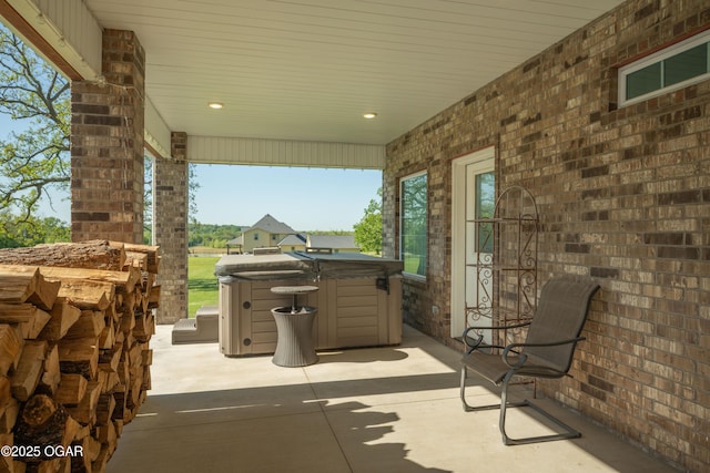 8740 County Road 241, Webb City, MO 64870 - view of patio featuring a hot tub