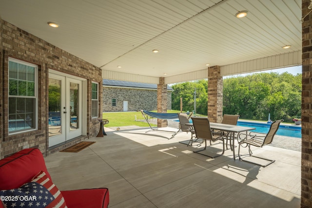8740 County Road 241, Webb City, MO 64870 - view of patio featuring french doors, an outdoor pool, and outdoor dining area