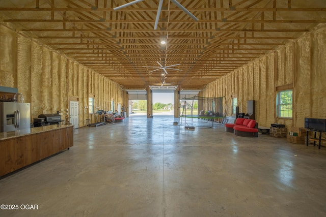 8740 County Road 241, Webb City, MO 64870 - garage featuring stainless steel refrigerator with ice dispenser