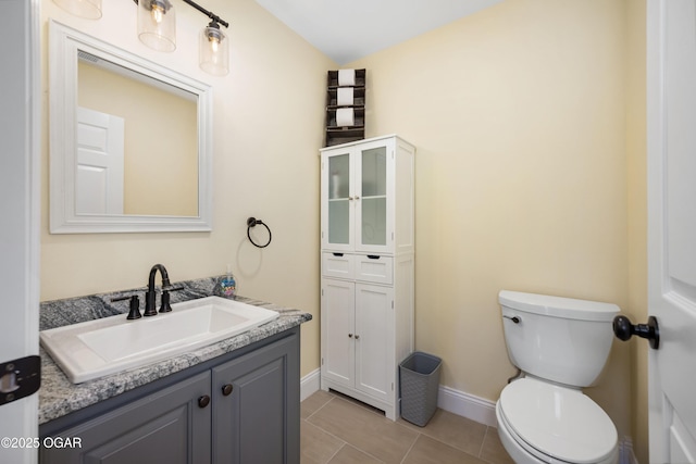 8740 County Road 241, Webb City, MO 64870 - bathroom featuring baseboards, toilet, vanity, and tile patterned floors